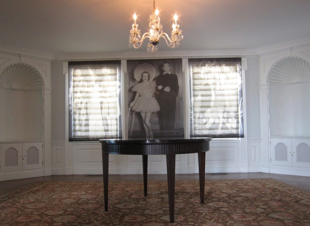 Inside a room at the Marion Davies Guest House on the grounds of the Annenberg Beach House. The window shades and wall photographs display historic images of celebrities who partied on the property as guests of Davies. Photo Credit: Saul Rubin