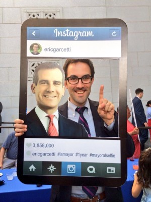 Carter Rubin poses with a cardboard cutout of Mayor Eric Garcetti on Instagram.
