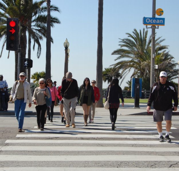 People crossing Ocean Avenue into Downtown Santa Monica from Palisades Park. Photo via the Pedestrian Action Plan.