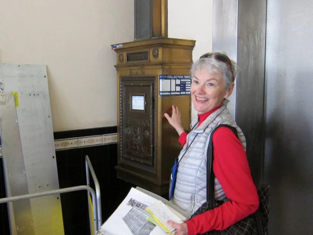 Santa Monica Conservancy tour guide Dorothy Jewell points out a vintage mailbox still in use in the Central Tower Building at 1424 Fourth Street, which dates to 1925. Photo:Saul Rubin