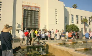 Opponents of the project gather in front of City Hall shortly before Tuesday's Council meeting.